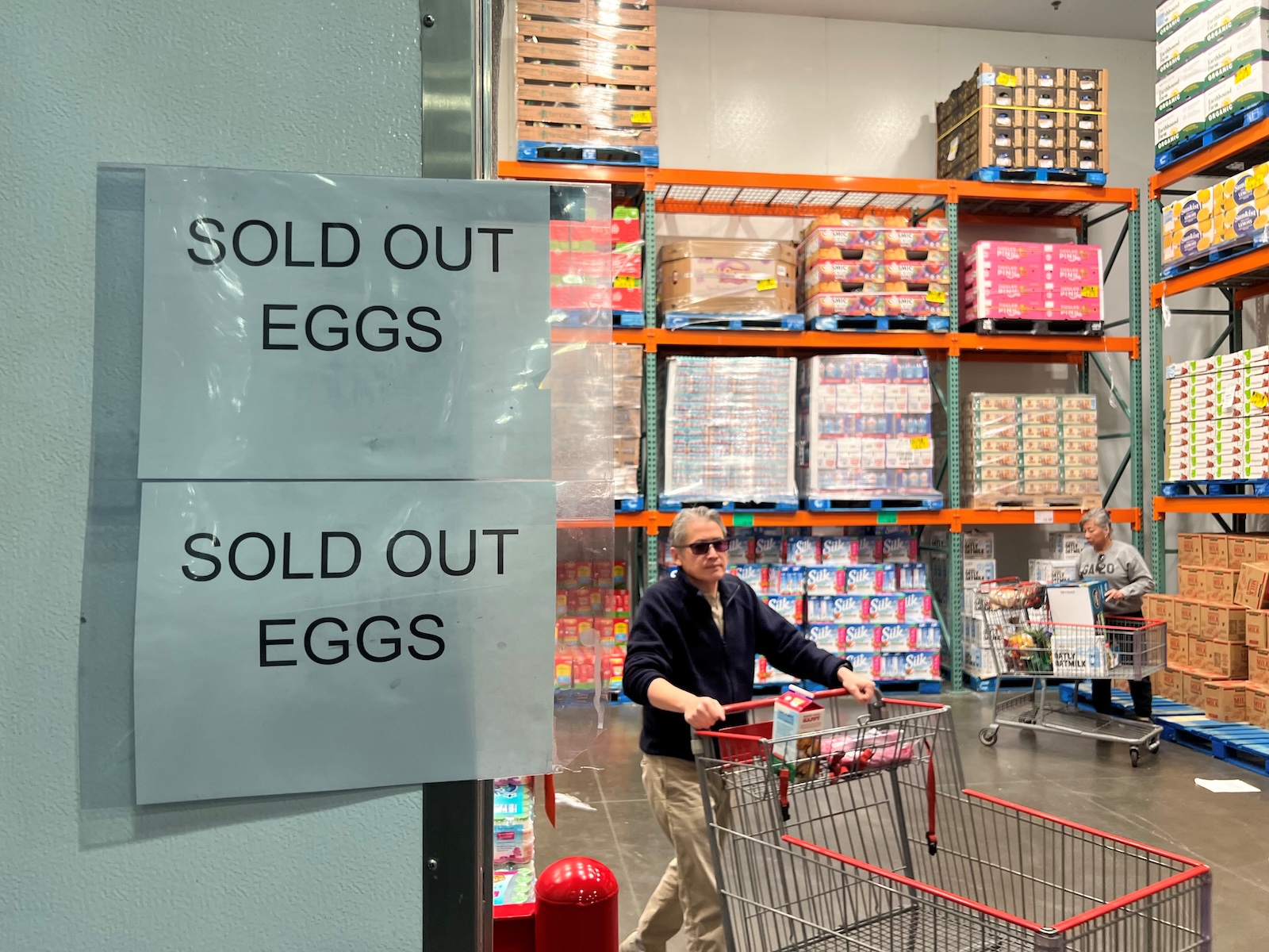 signs saying "SOLD OUT EGGS" in front of the egg section at CostCo